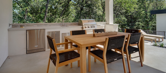backyard kitchen with teak outdoor furniture